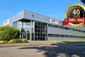 Photo of Hiden's factory with the 40th anniversary logo overlayed