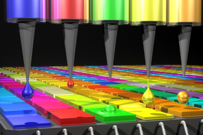 In this illustration, the Quantum Dot (QD) spectrometer device is printing QD filters—a key fabrication step. Other spectrometer approaches have complicated systems in order to create the optical structures needed. Here in the QD spectrometer approach, the optical structure, QD filters, are generated by printing liquid droplets. This approach is unique and advantageous in terms of flexibility, simplicity and cost reduction. Image: Mary O’Reilly