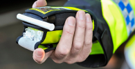 Photo of a policeman holding a breathalyser