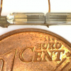 Image of the optical fibre resonator compared to the size of a Euro Cent coin.