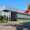 Photo of Hiden's factory with the 40th anniversary logo overlayed